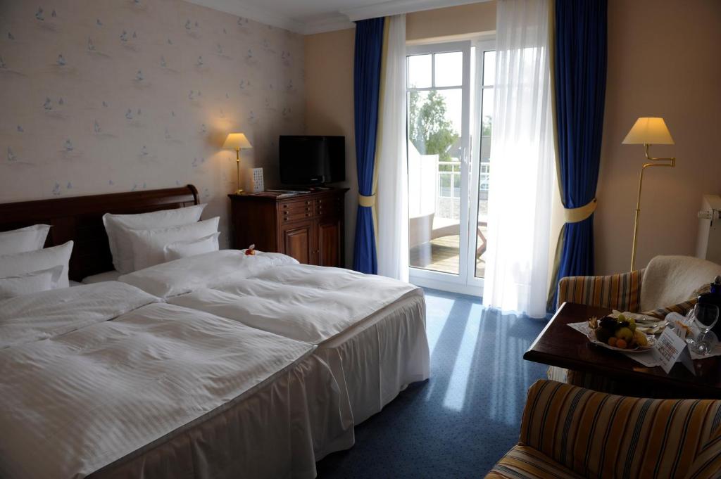 Postel nebo postele na pokoji v ubytování Hotel Meerlust