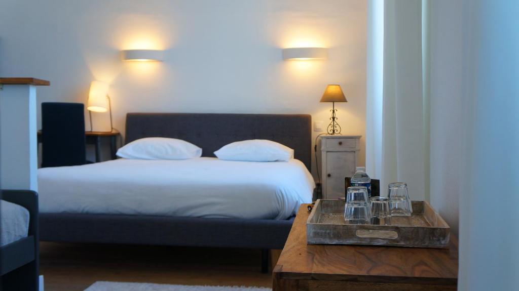 Postel nebo postele na pokoji v ubytování Hotel Savel