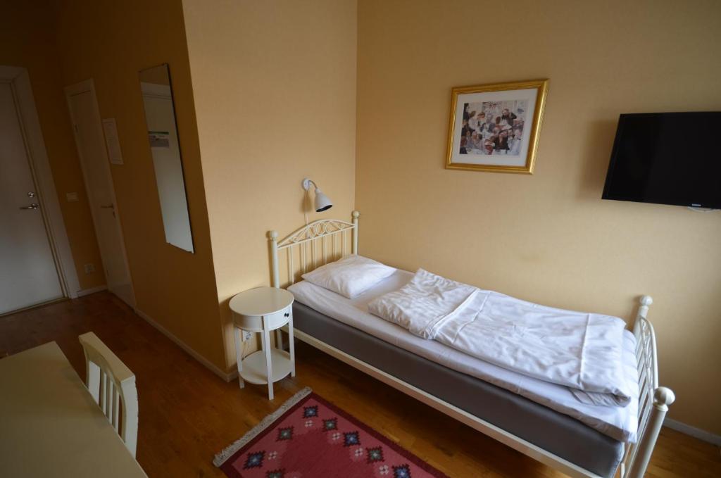 Postel nebo postele na pokoji v ubytování Hotell Royal