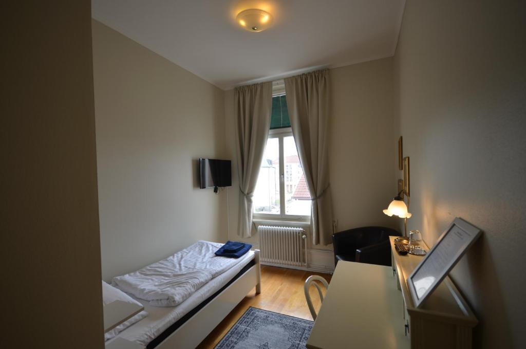 Postel nebo postele na pokoji v ubytování Hotell Royal