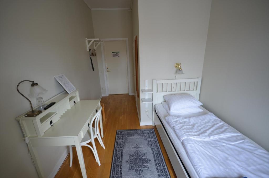 Postel nebo postele na pokoji v ubytování Hotell Royal