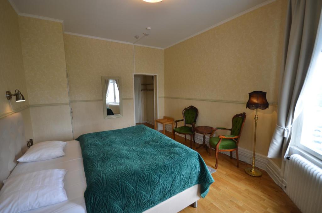 Postel nebo postele na pokoji v ubytování Hotell Royal