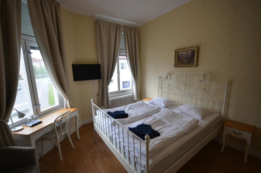 Postel nebo postele na pokoji v ubytování Hotell Royal