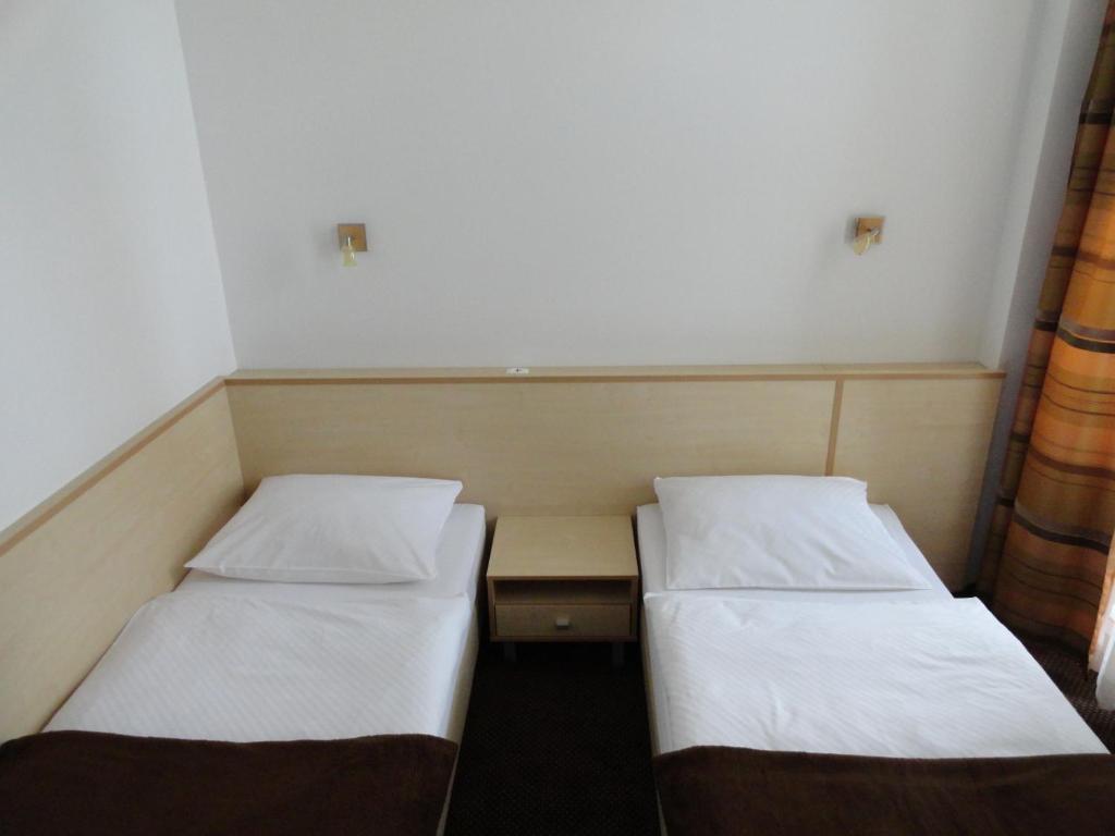 Postel nebo postele na pokoji v ubytování Rooms K