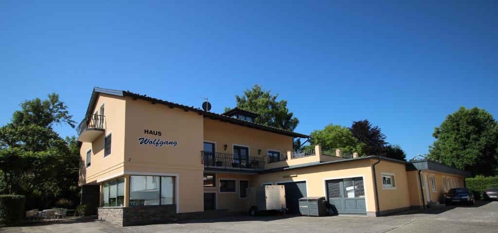 a building with a parking lot in front of it at Haus Wolfgang in Reifnitz