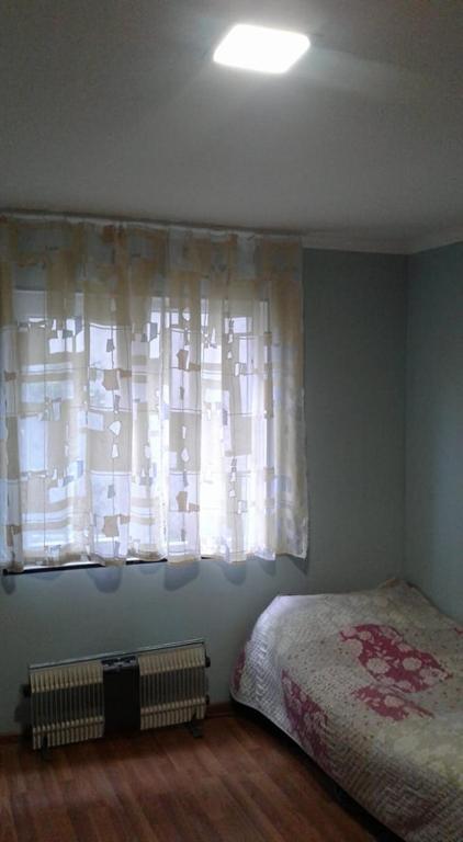 Postel nebo postele na pokoji v ubytování Guest Houze Nona