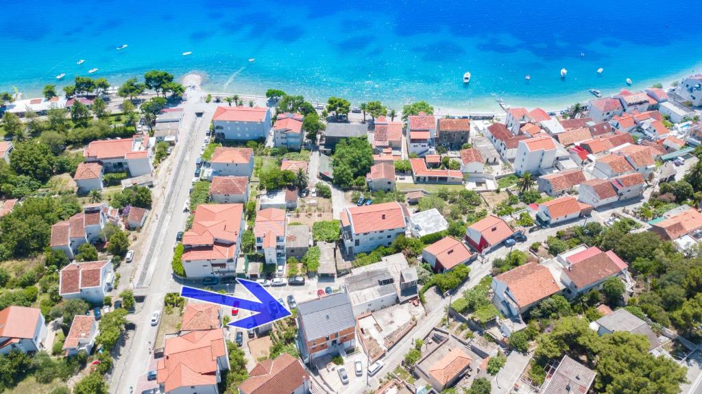 an aerial view of a city with houses and the ocean at Apartments Latkovic in Zaostrog