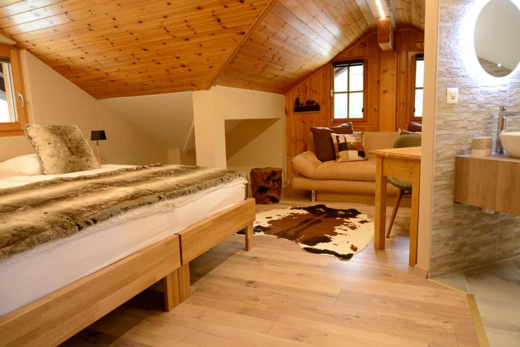 Postel nebo postele na pokoji v ubytování Hôtel Dents de Veisivi