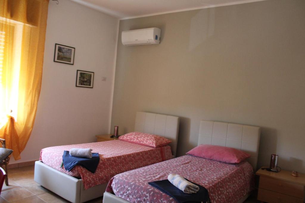 Postel nebo postele na pokoji v ubytování B&b Paolo e Daniela
