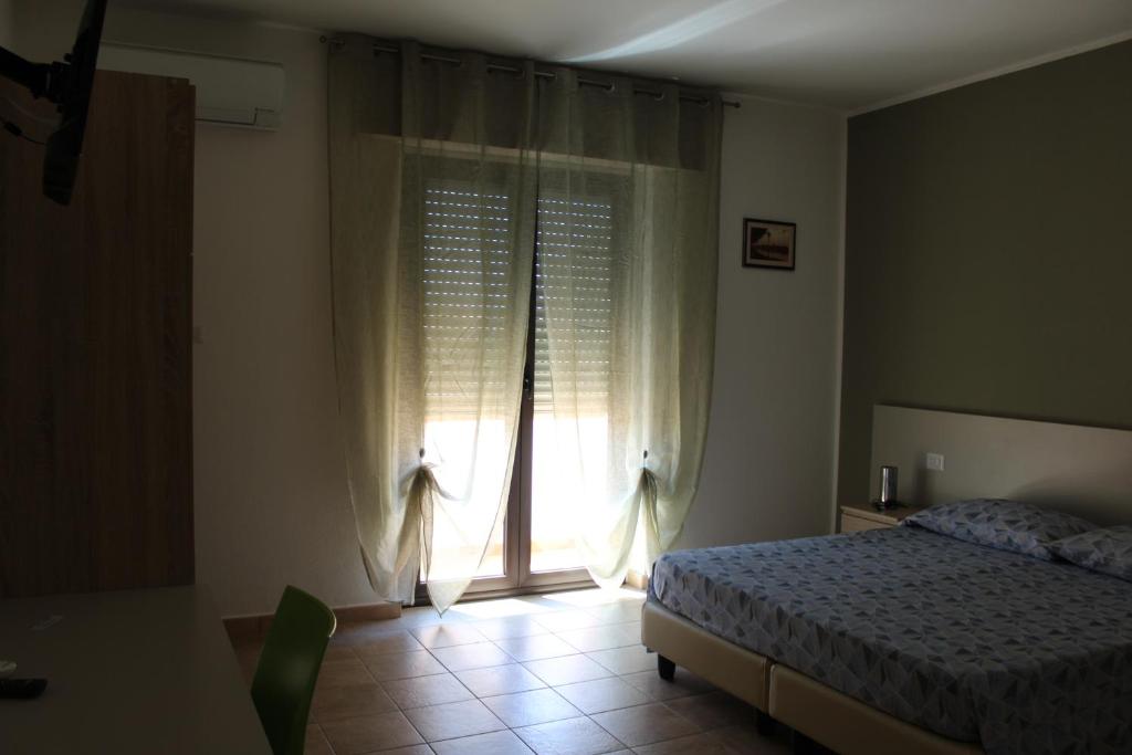 Postel nebo postele na pokoji v ubytování B&b Paolo e Daniela