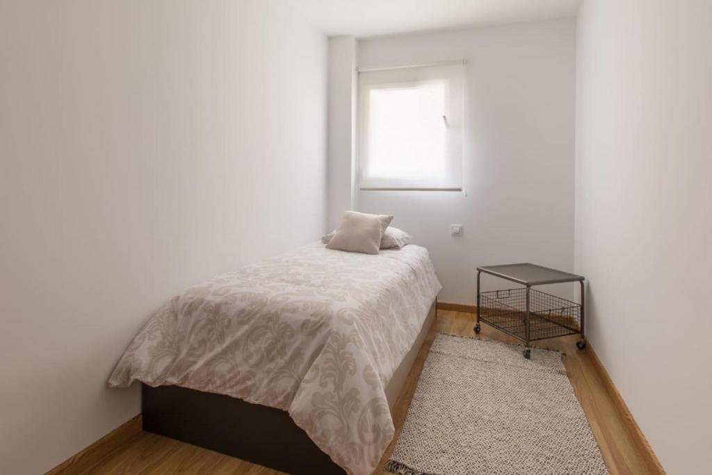 Postel nebo postele na pokoji v ubytování Apartamento La Nuit con Parking gratis en centro histórico