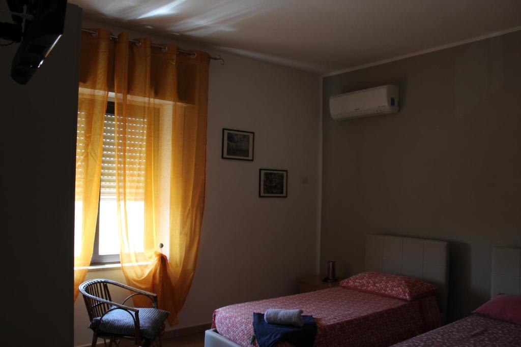 Postel nebo postele na pokoji v ubytování B&b Paolo e Daniela