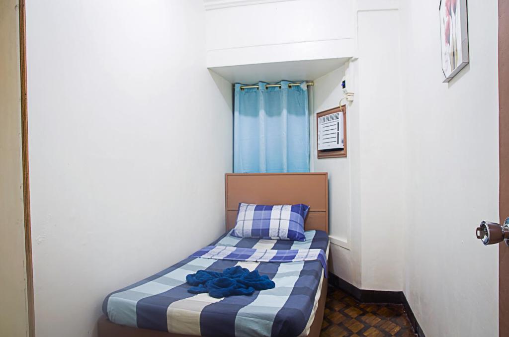 Postel nebo postele na pokoji v ubytování RedDoorz @ Calceta Street Cogon