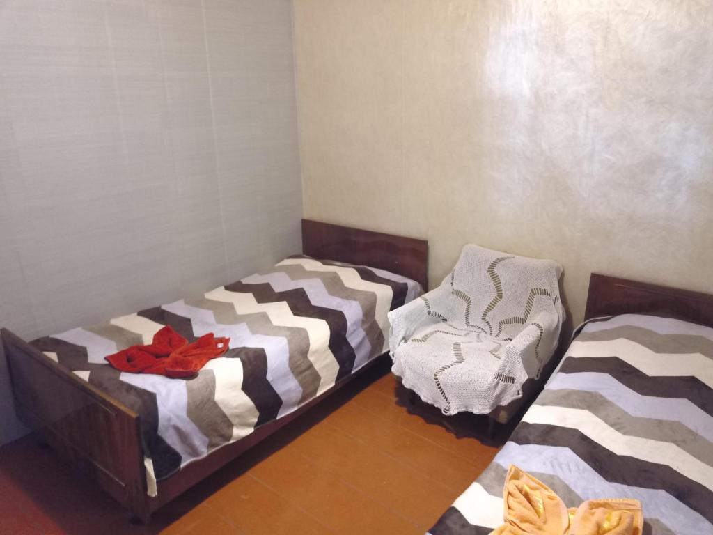 Postel nebo postele na pokoji v ubytování Guest House Tengo