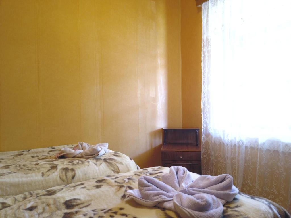 Postel nebo postele na pokoji v ubytování Guest House Tengo
