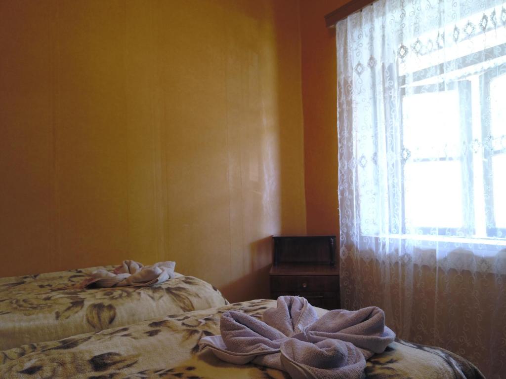Postel nebo postele na pokoji v ubytování Guest House Tengo