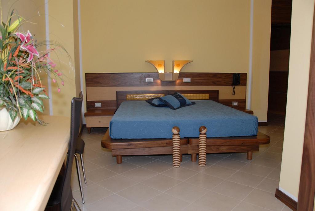 Postel nebo postele na pokoji v ubytování Hotel Miramare