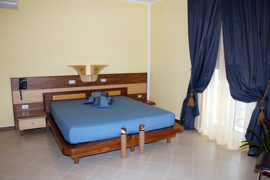 Postel nebo postele na pokoji v ubytování Hotel Miramare