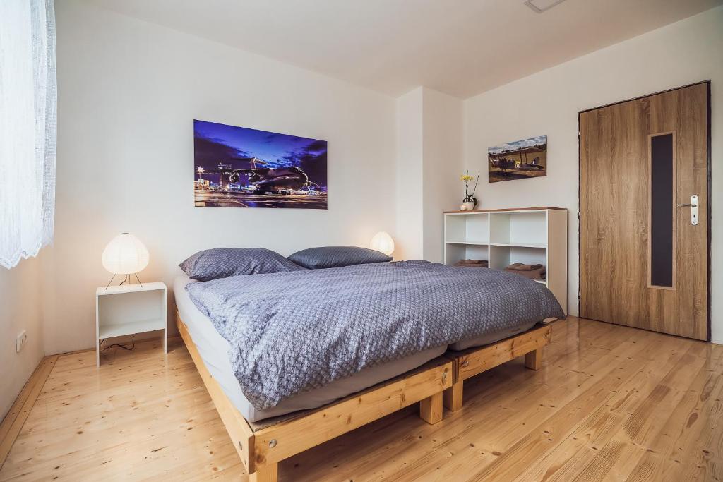 Posteľ alebo postele v izbe v ubytovaní Skodova Apartments