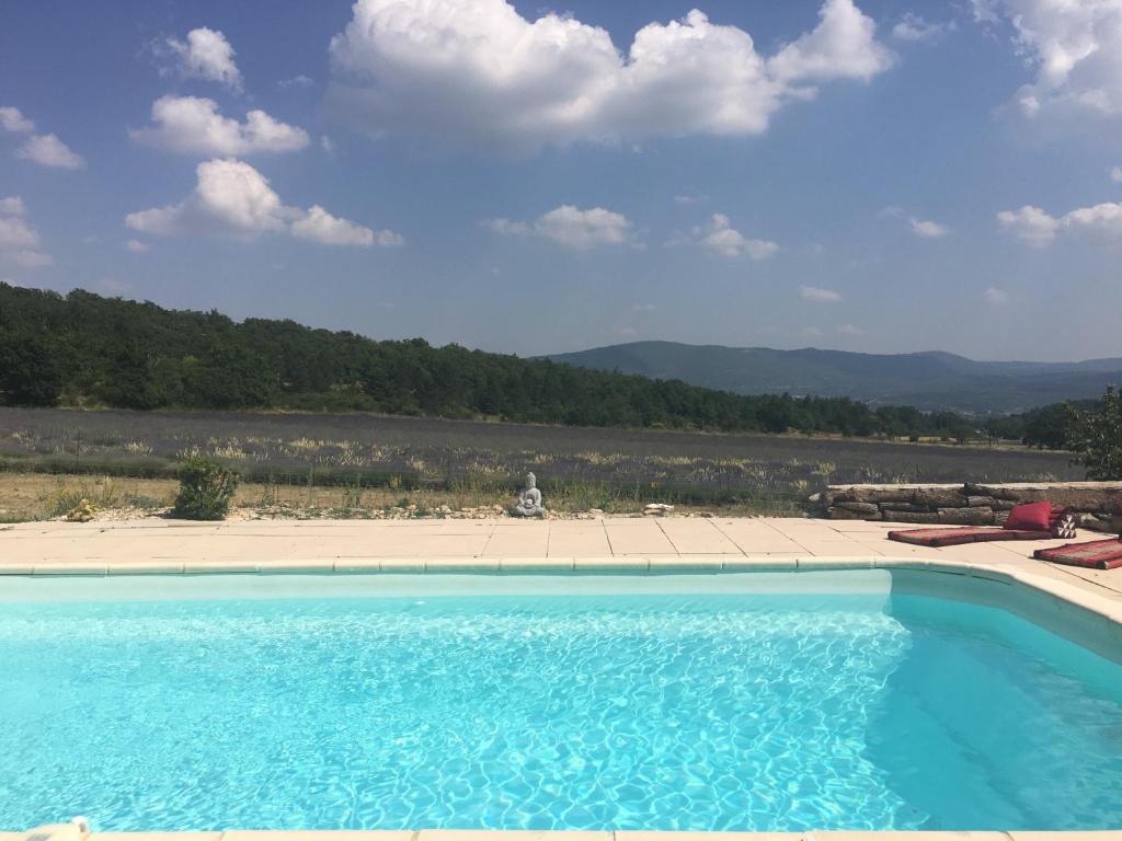 a swimming pool with a view of the mountains at Le Jas du Mont Ventoux in Sault-de-Vaucluse
