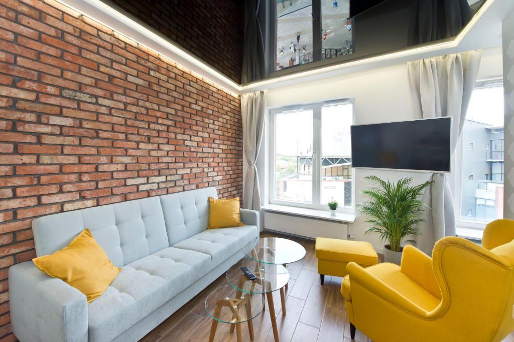 TV a/nebo společenská místnost v ubytování YOURAPART Rajska City Centre