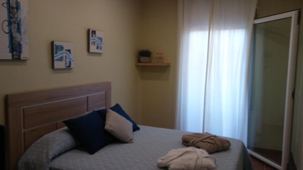Postel nebo postele na pokoji v ubytování Hostal Sant Roc