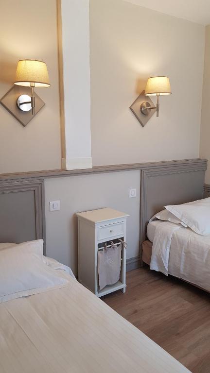 Postel nebo postele na pokoji v ubytování Hotel Berneron
