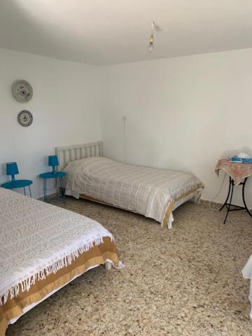 Łóżko lub łóżka w pokoju w obiekcie Panagopoulos House