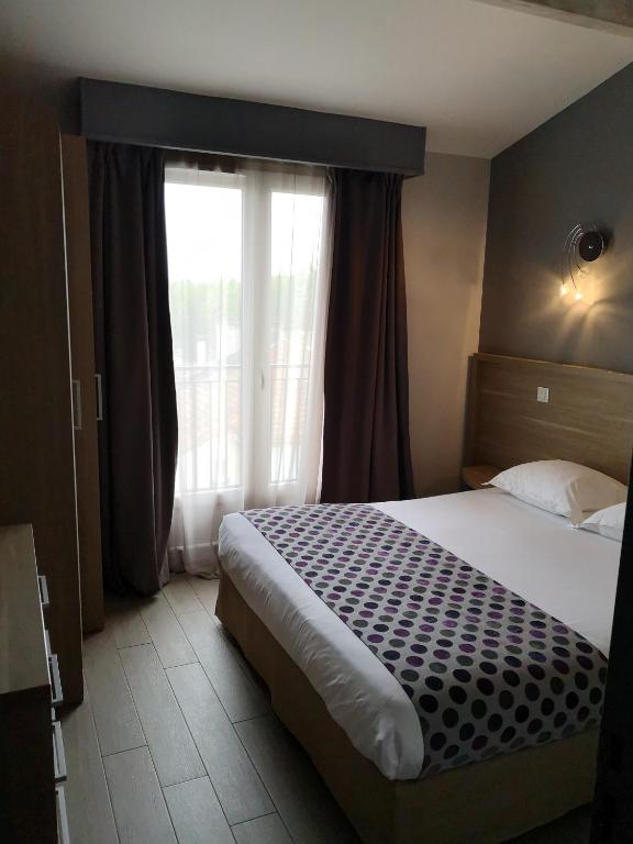 Postel nebo postele na pokoji v ubytování Atoll Hotel restaurant