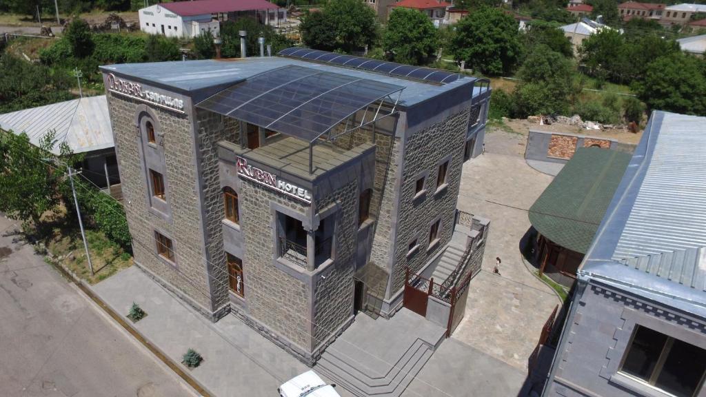 an overhead view of a building with a solar roof at Rubin Hotel in Goris