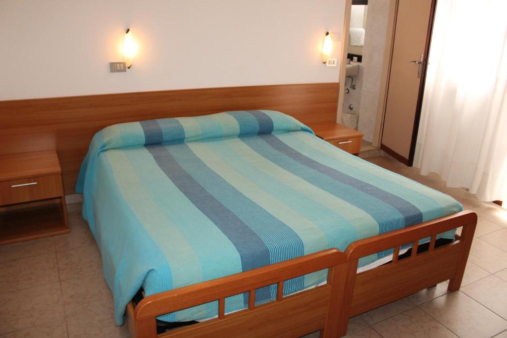 Postel nebo postele na pokoji v ubytování Hotel Caravel