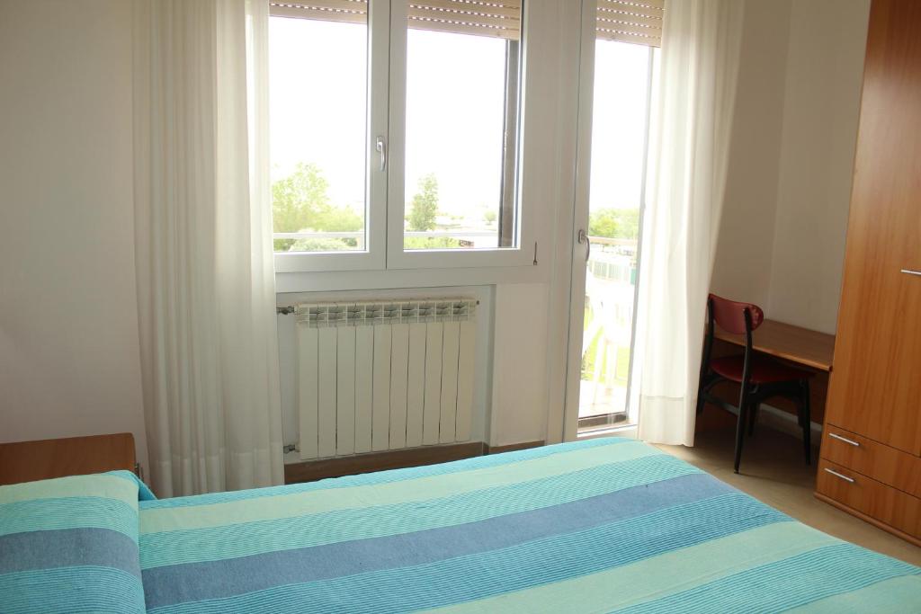 Postel nebo postele na pokoji v ubytování Hotel Caravel