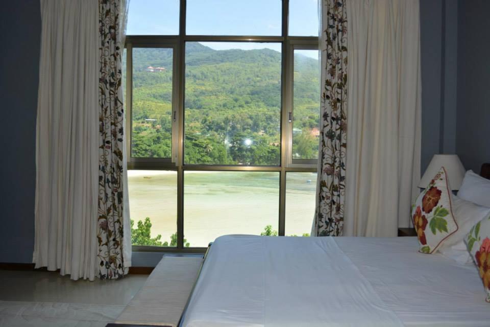 Postel nebo postele na pokoji v ubytování Bayview Villas Seychelles