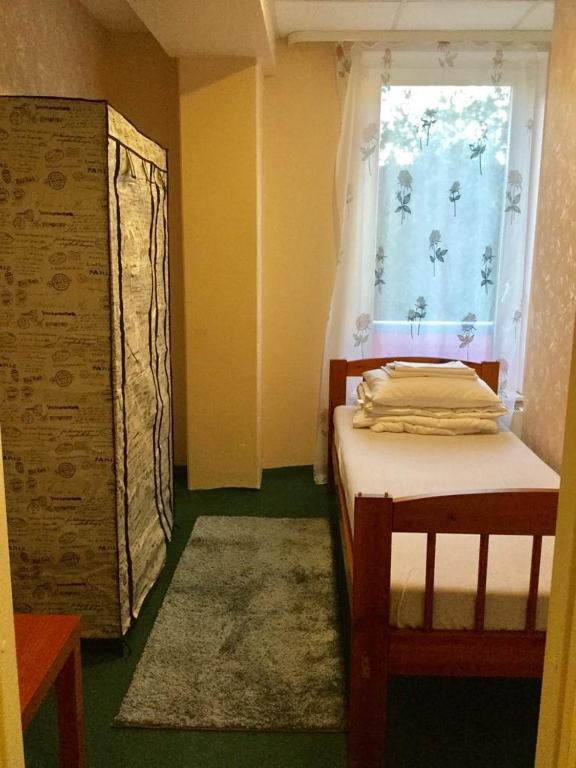 Postel nebo postele na pokoji v ubytování Harbour Hub Hostel