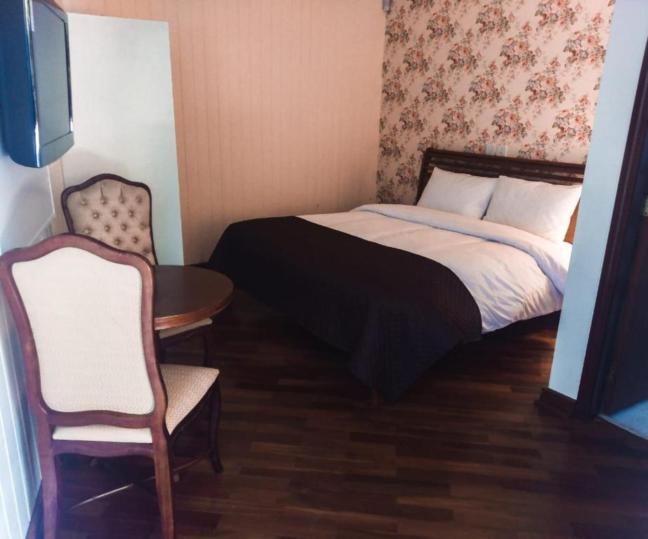 Postel nebo postele na pokoji v ubytování Refúgio das Rosas