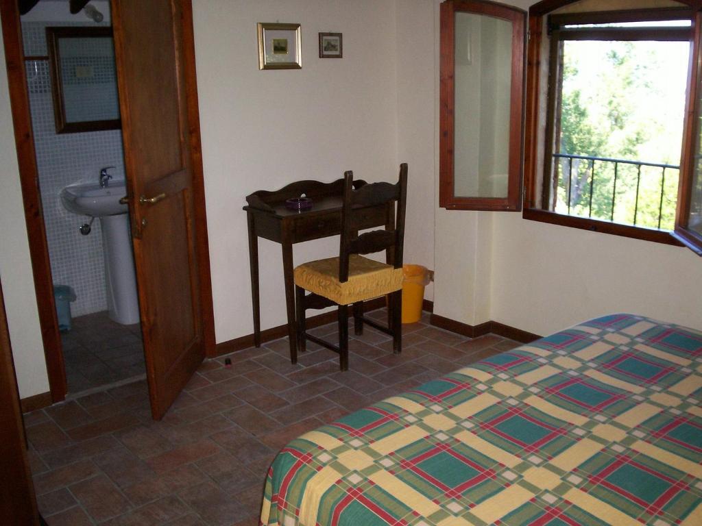 Posteľ alebo postele v izbe v ubytovaní Podere Il Caggio Rooms
