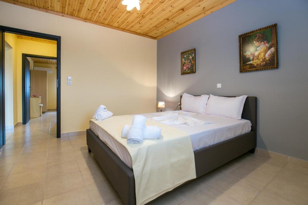 Postel nebo postele na pokoji v ubytování Grande Apartments
