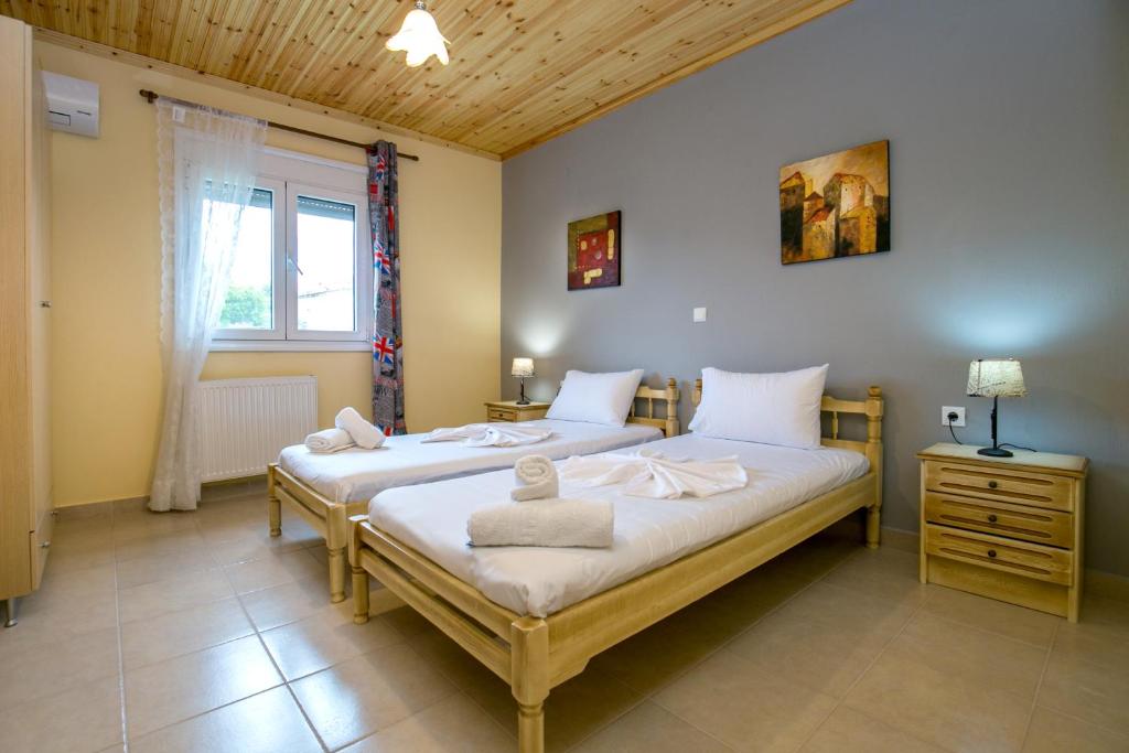 Postel nebo postele na pokoji v ubytování Grande Apartments