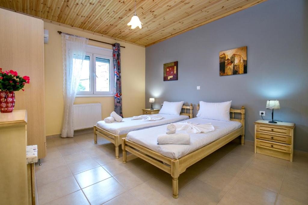 Postel nebo postele na pokoji v ubytování Grande Apartments