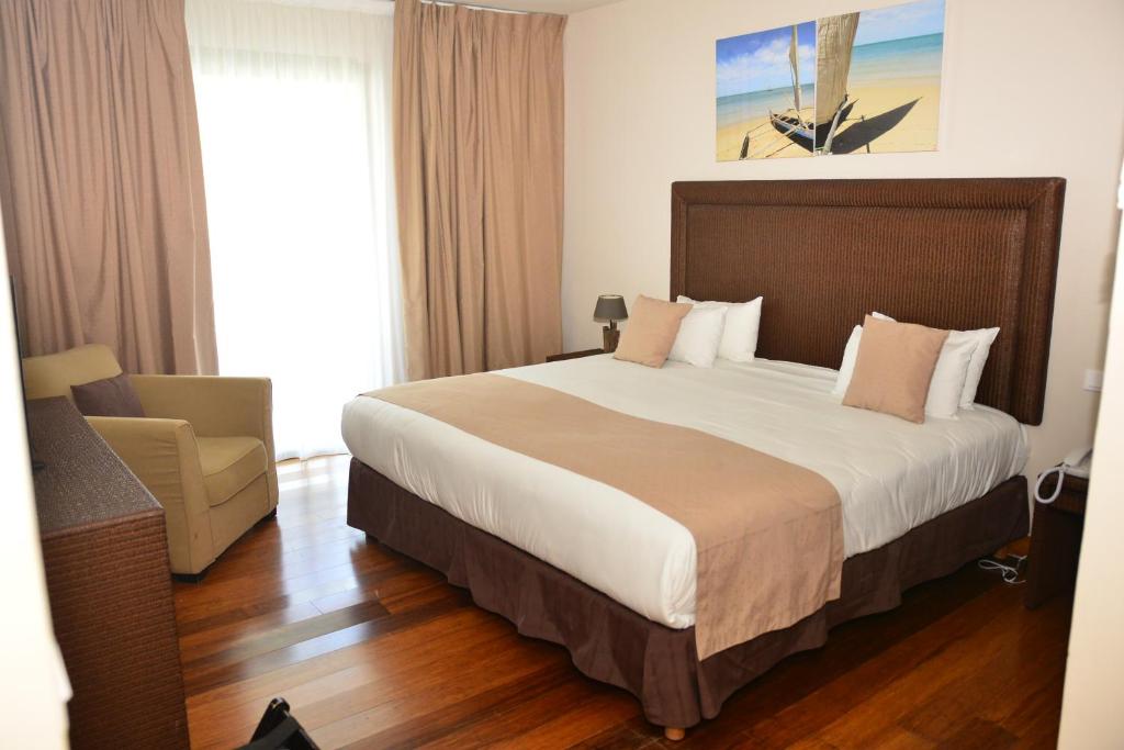 Postel nebo postele na pokoji v ubytování Hotel Fleur d'Epee