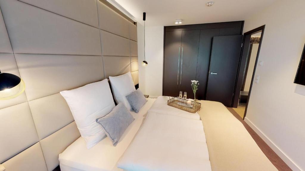 Postel nebo postele na pokoji v ubytování White Pearl Apartment 1.06
