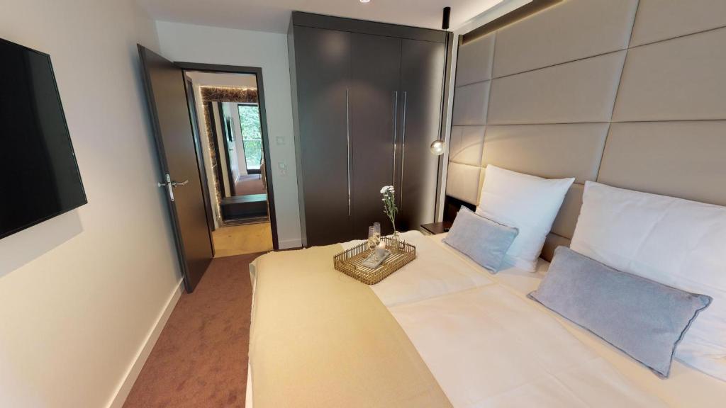 Postel nebo postele na pokoji v ubytování White Pearl Apartment 1.06