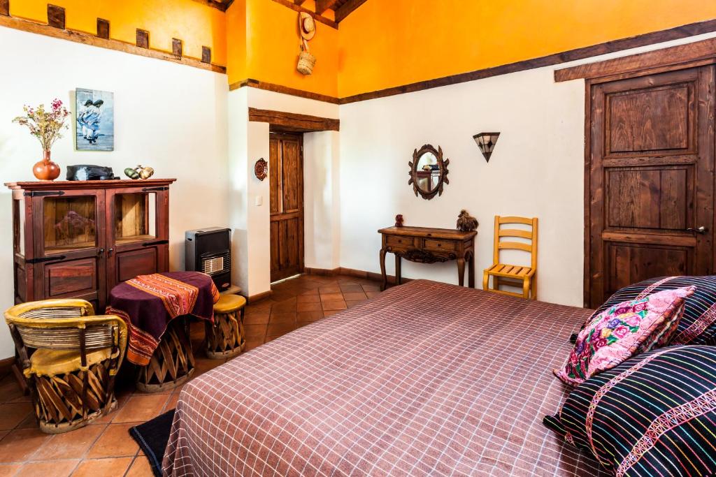 Postel nebo postele na pokoji v ubytování Posada Yolihuani