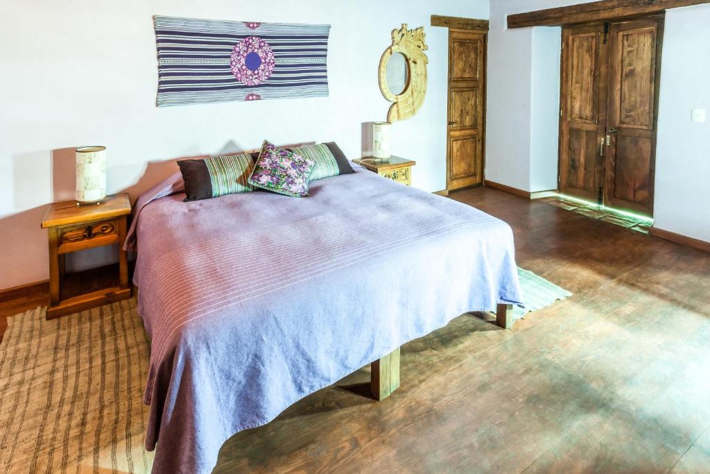 Postel nebo postele na pokoji v ubytování Posada Yolihuani