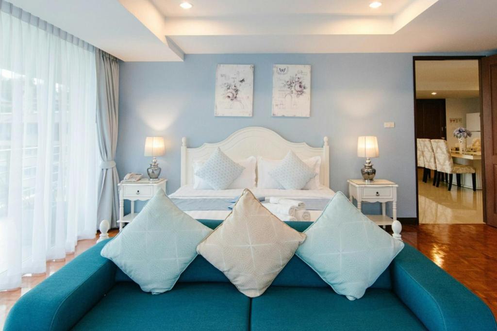 Postel nebo postele na pokoji v ubytování SeaRidge Hua Hin Resort & Poolvilla
