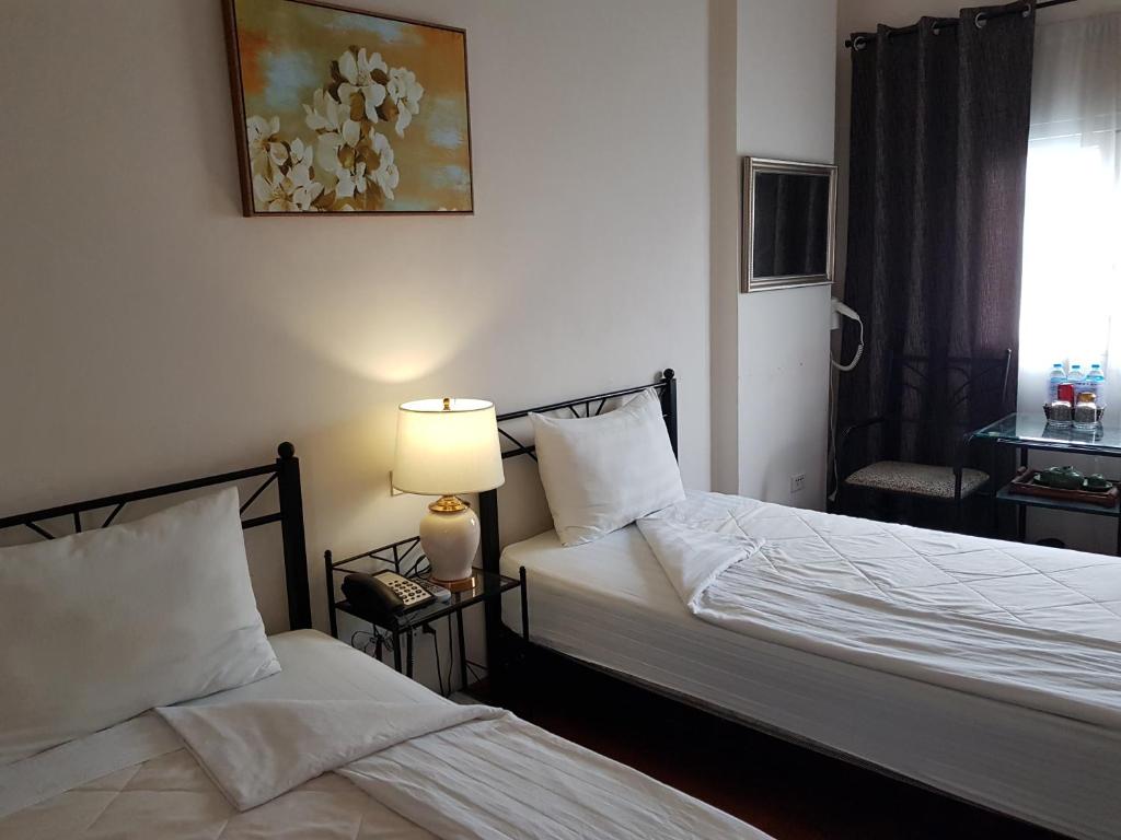 Postel nebo postele na pokoji v ubytování Memory Hotel