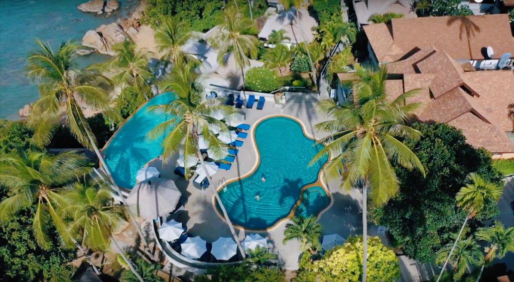 Bazén v ubytování Coral Cliff Beach Resort Samui - SHA Plus nebo v jeho okolí