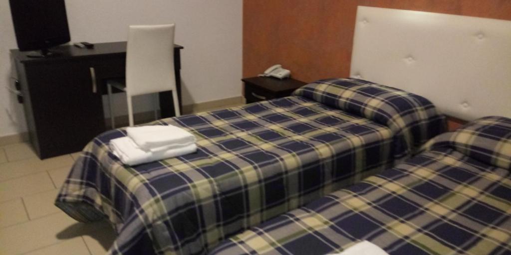 Postel nebo postele na pokoji v ubytování Hotel 660