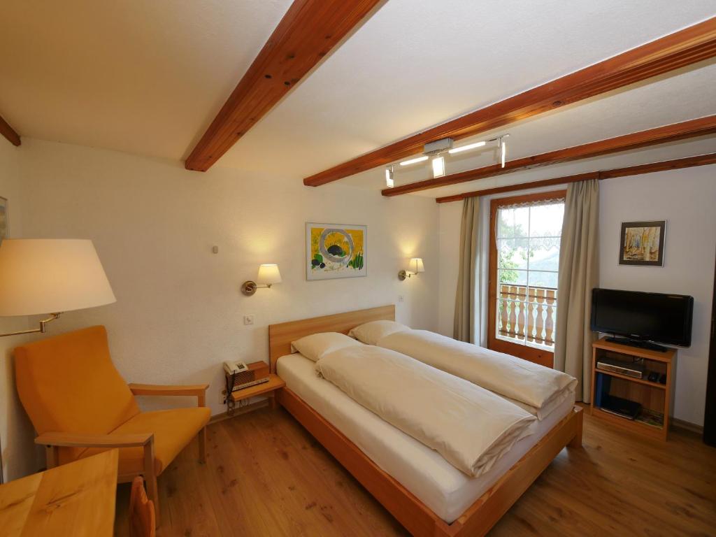 Postel nebo postele na pokoji v ubytování Hotel Alpenblick