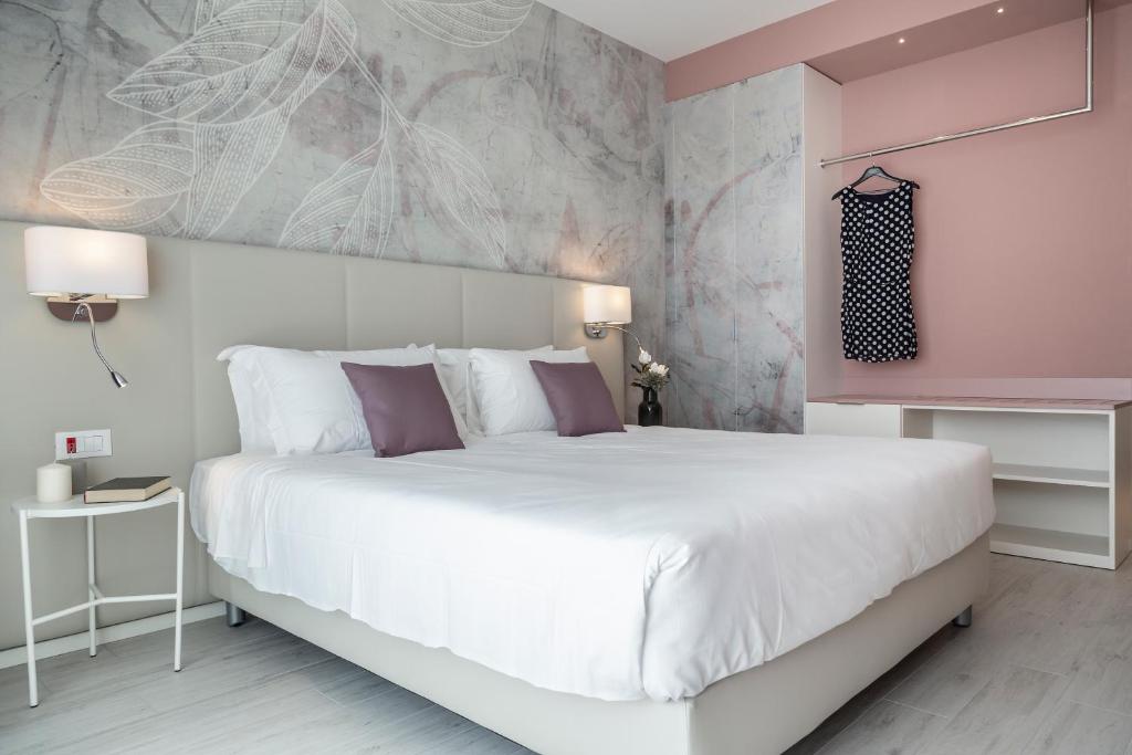 Кровать или кровати в номере Hotel Amburgo